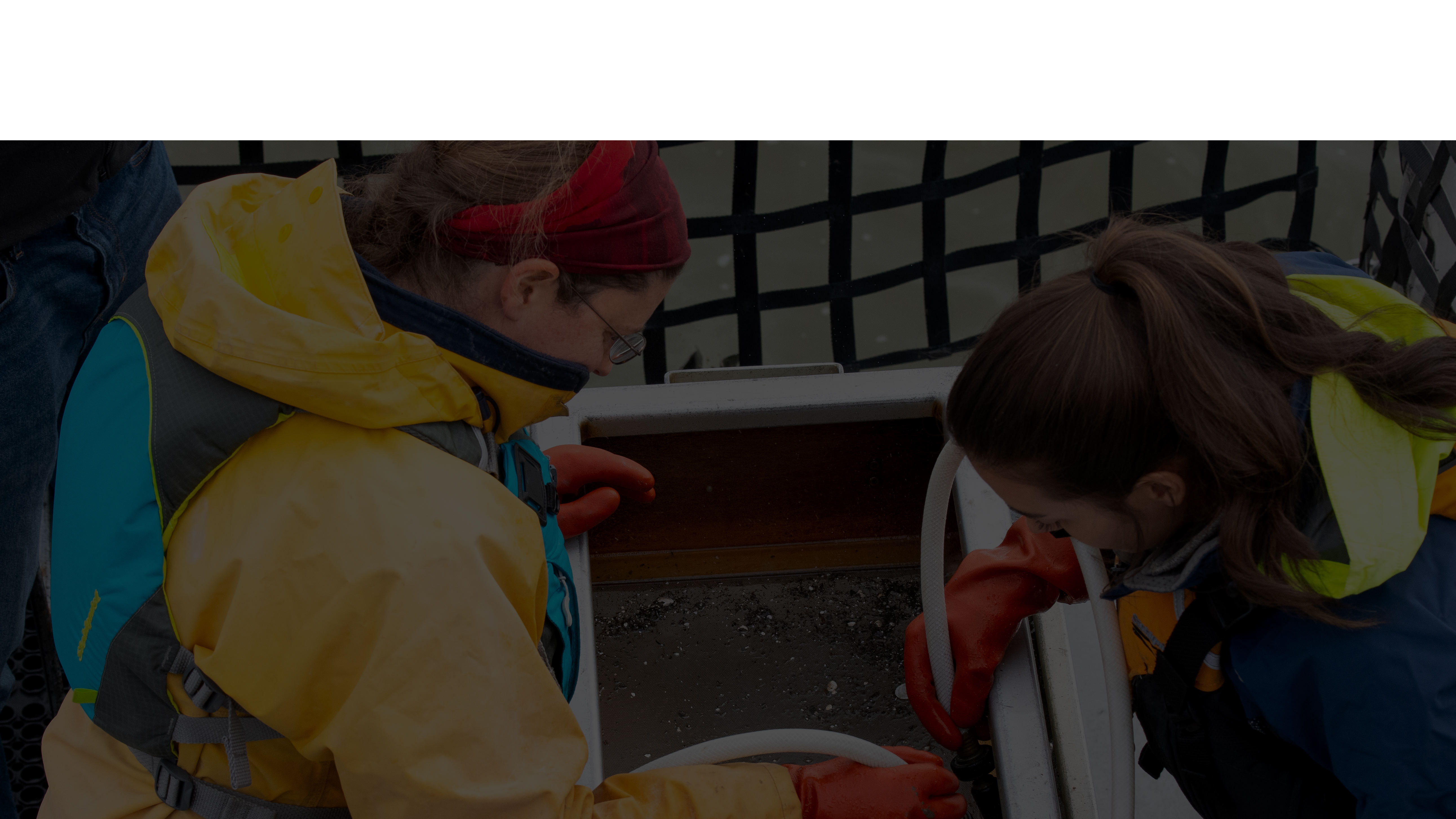 Environmental scientists performing biological monitoring aboard the Sentinel research vessel in the Sacramento-San Joaquin Delta.