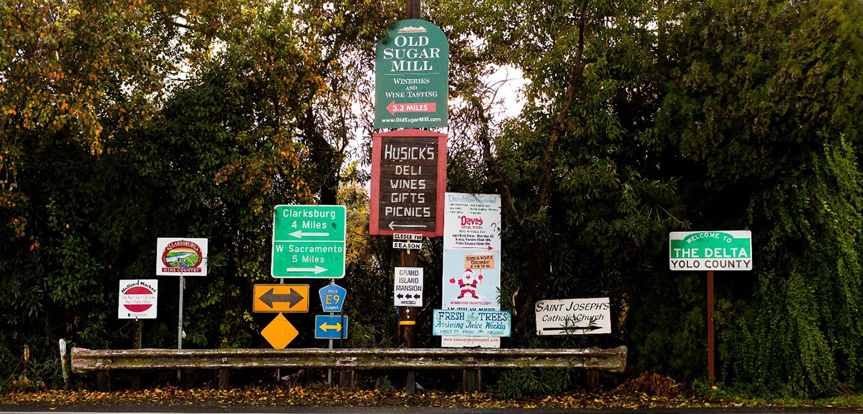 A collection of road and business signs in the Delta, Yolo County. A collection of road and business signs in the Delta, Yolo County.