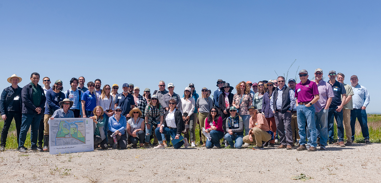 A group photo of DPIIC members and tour attendees at the Dutch Slough Tidal Restoration Project site.