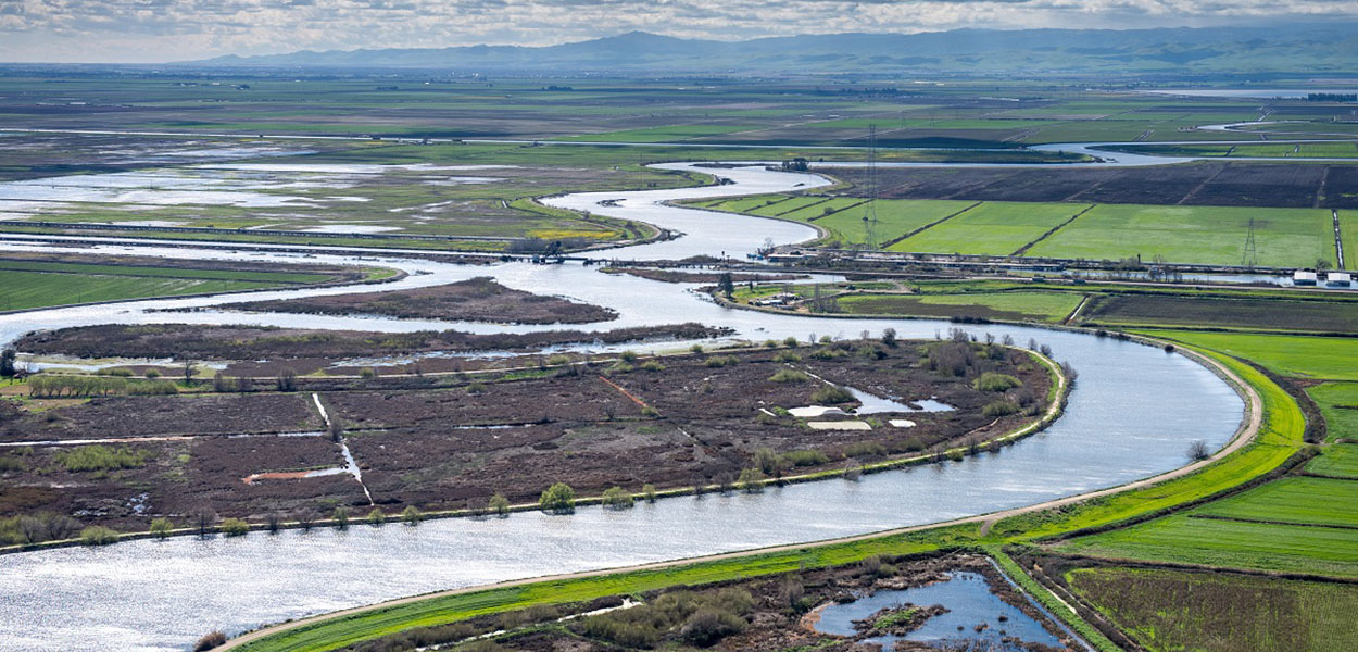 Aerial view looking south along Old River in the center is Fay Island, part of the Sacramento-San Joaquin River Delta in San Joaquin County, California.