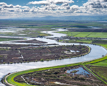 Aerial view looking south along Old River in the center is Fay Island, part of the Sacramento-San Joaquin River Delta in San Joaquin County, California.