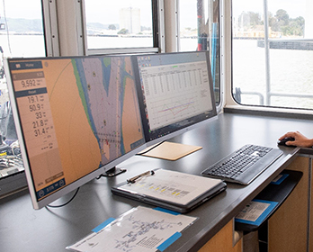 A scientist analyzing digital water sampling aboard the Department of Water Resources’ research vessel, the Sentinel, in the Sacramento-San Joaquin Delta.