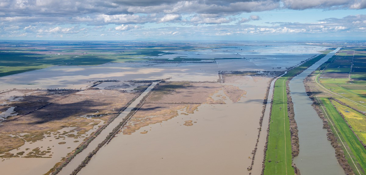 Aerial view of clouds hovering over partially flooded land in the Sacramento-San Joaquin Delta. Aerial view of clouds hovering over partially flooded land in the Sacramento-San Joaquin Delta.